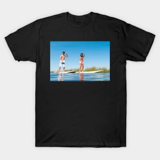 Man and woman stand up paddleboarding T-Shirt